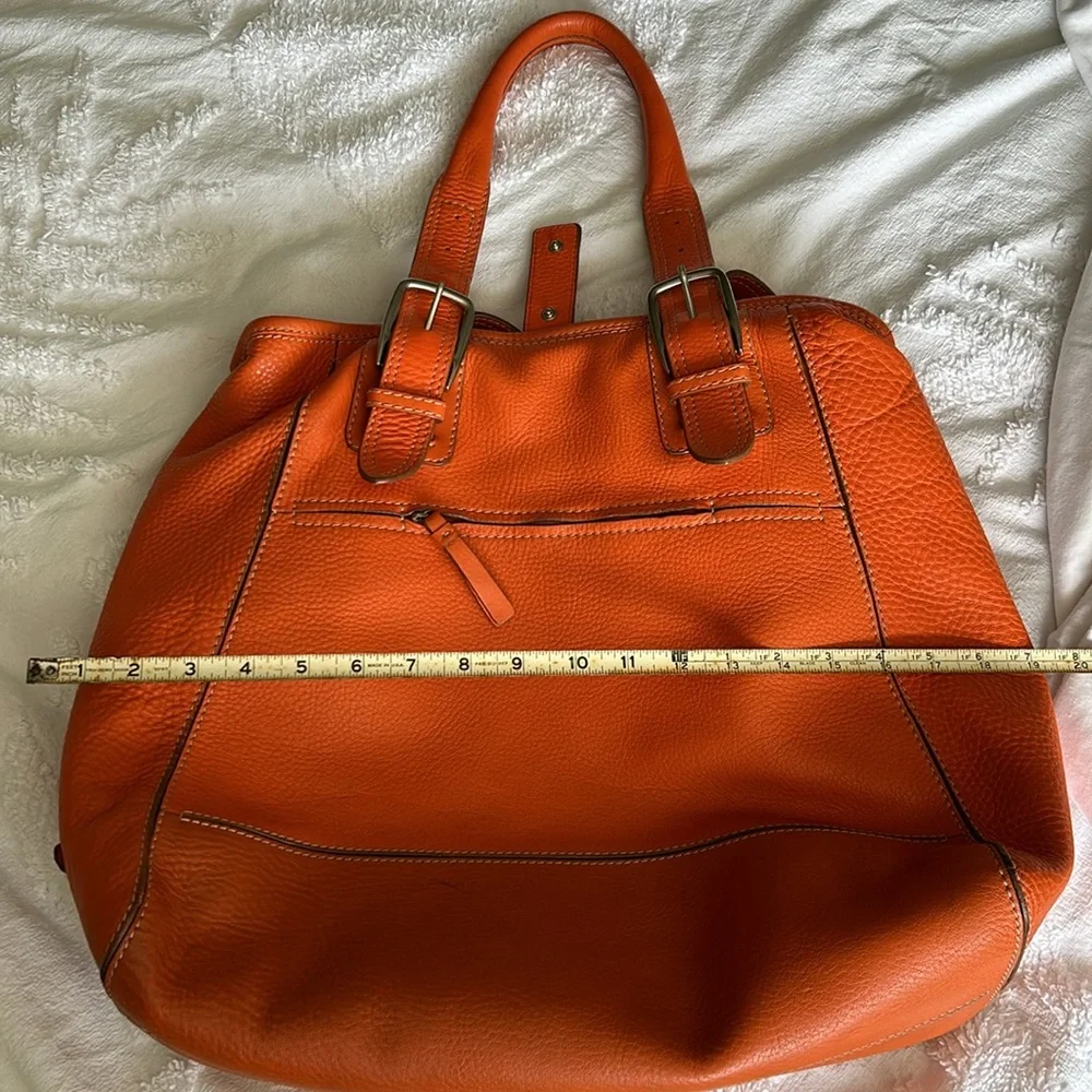 Large leather Cole Haan orange shoulder bag with silver hardware buckles. - Picture 7 of 16